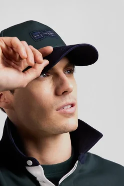 Green and navy cotton cap with tricolour details