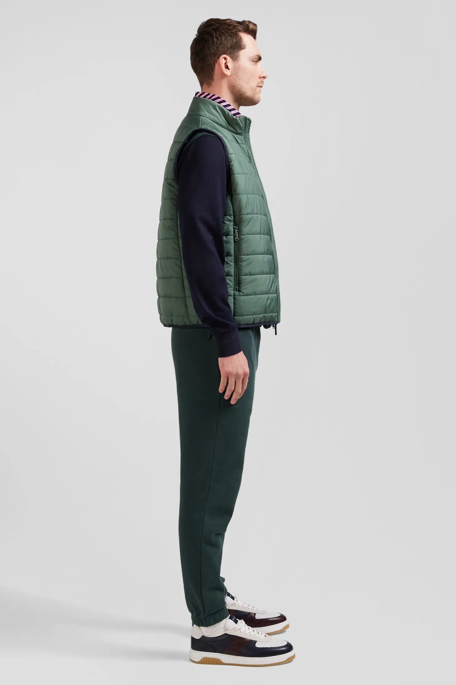 Green quilted sleeveless high collar down vest