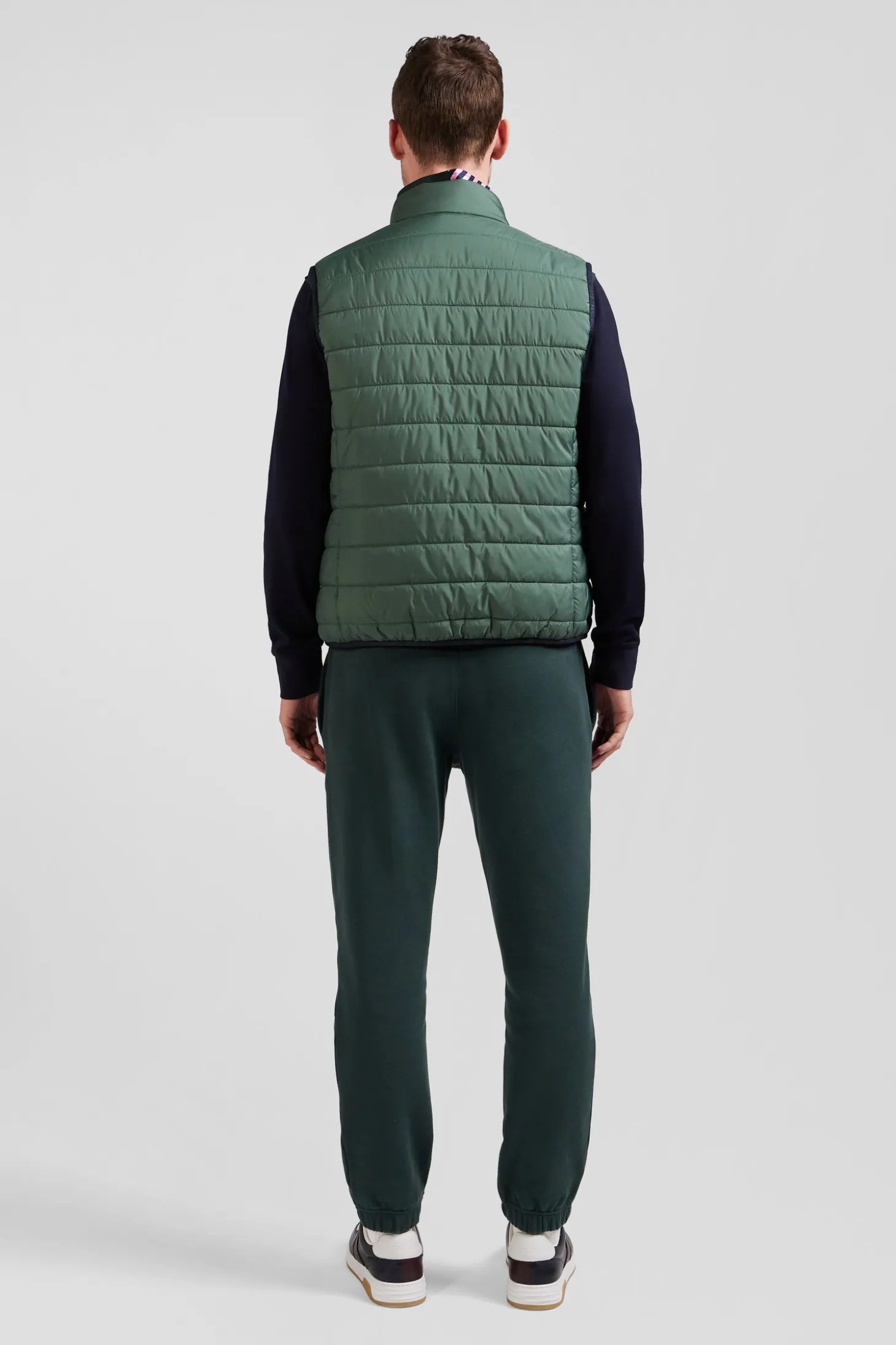 Green quilted sleeveless high collar down vest