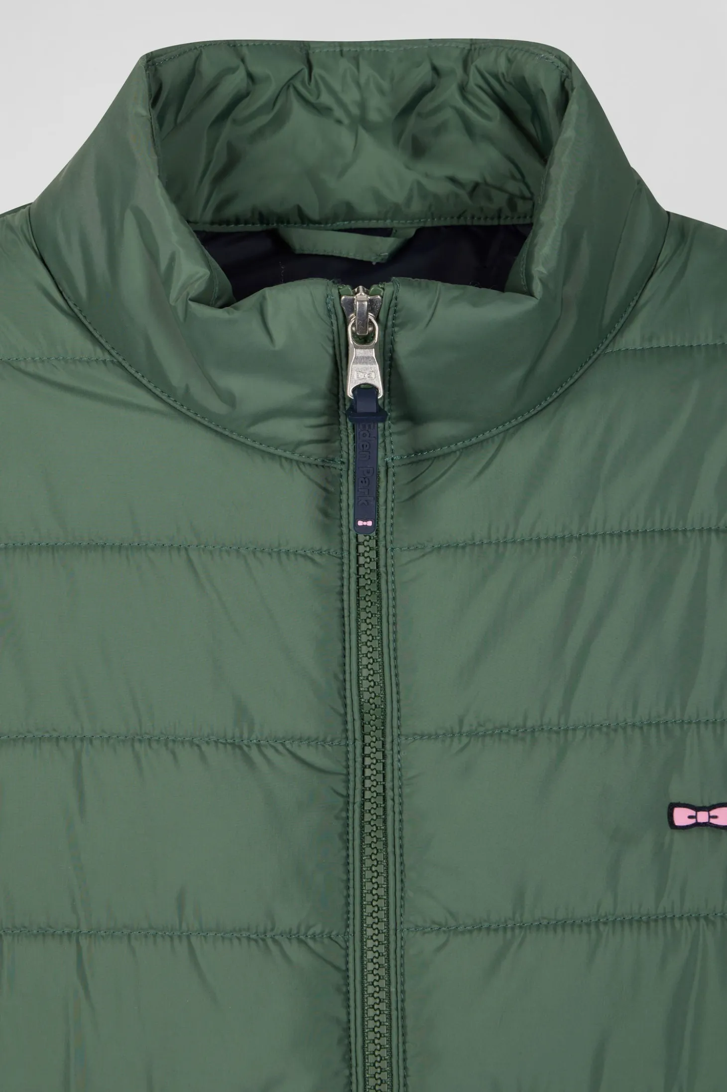 Green quilted sleeveless high collar down vest