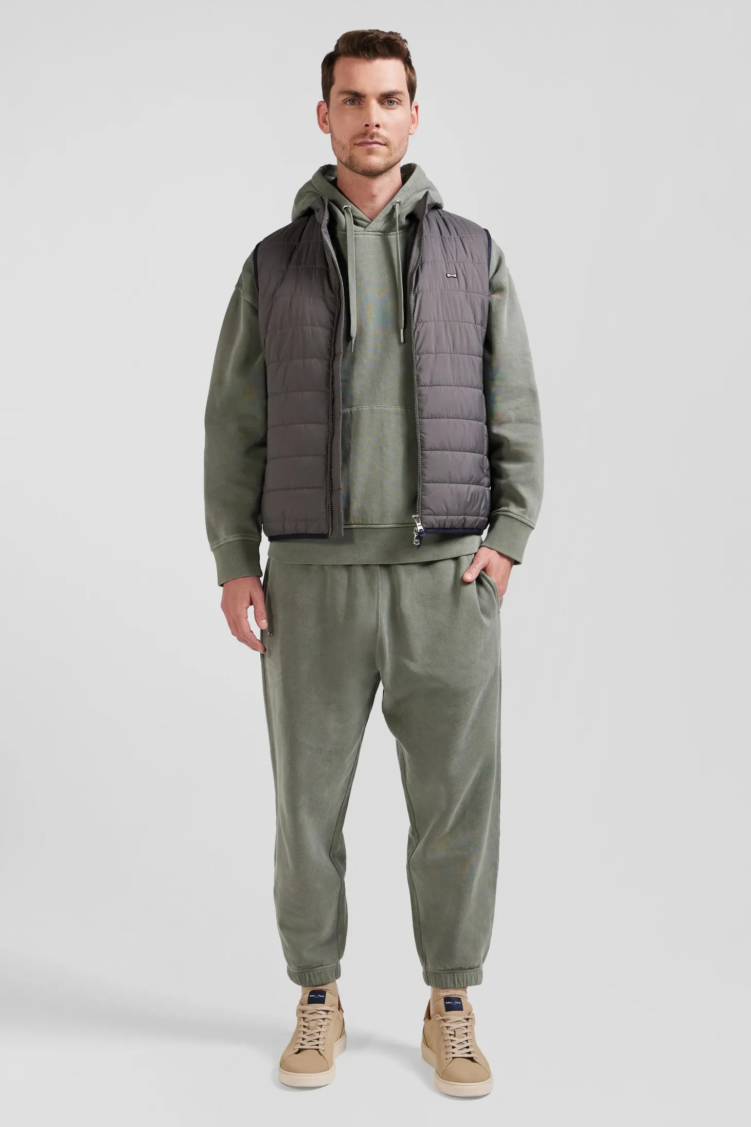 Grey quilted sleeveless high collar down vest
