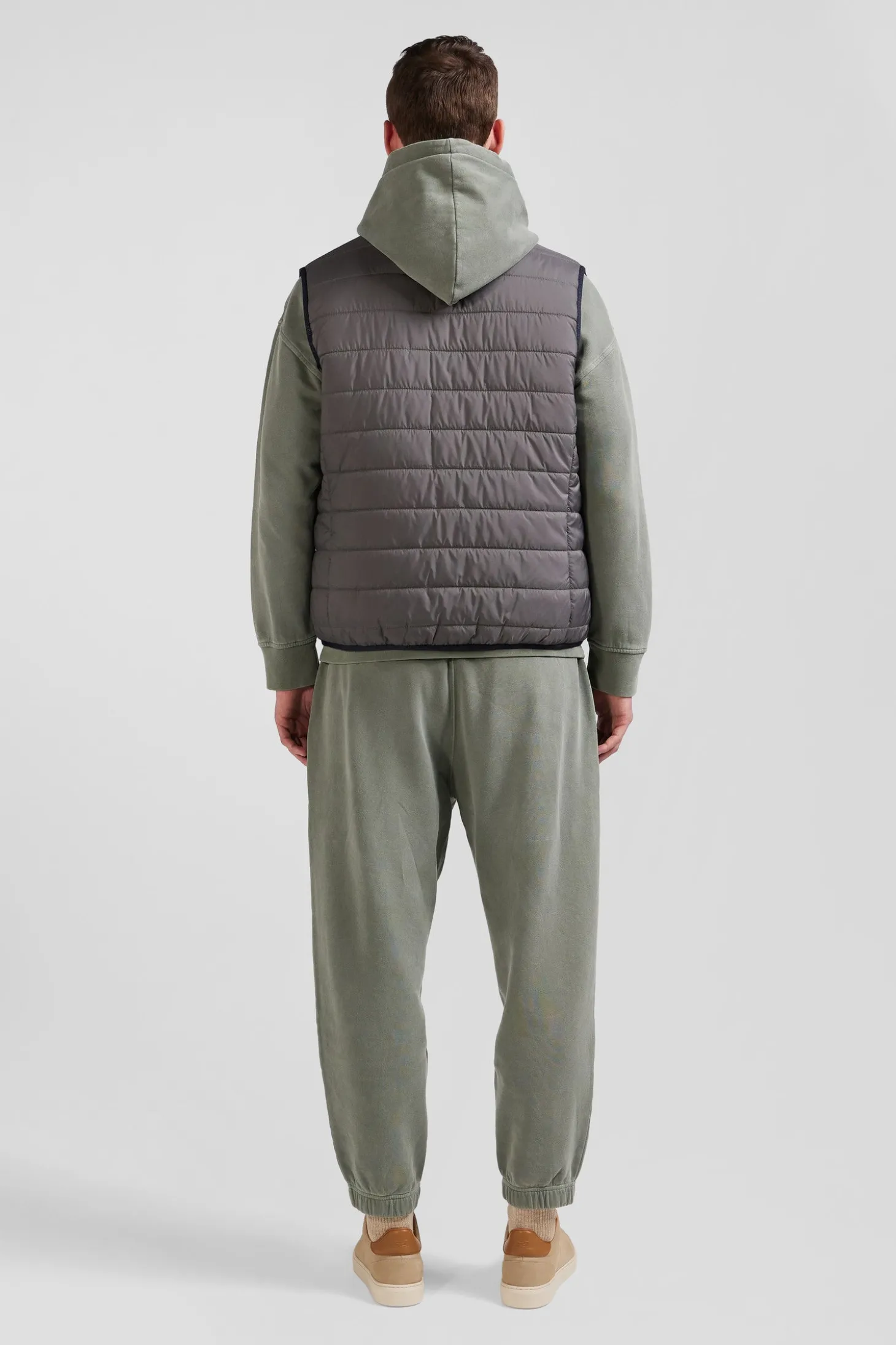Grey quilted sleeveless high collar down vest