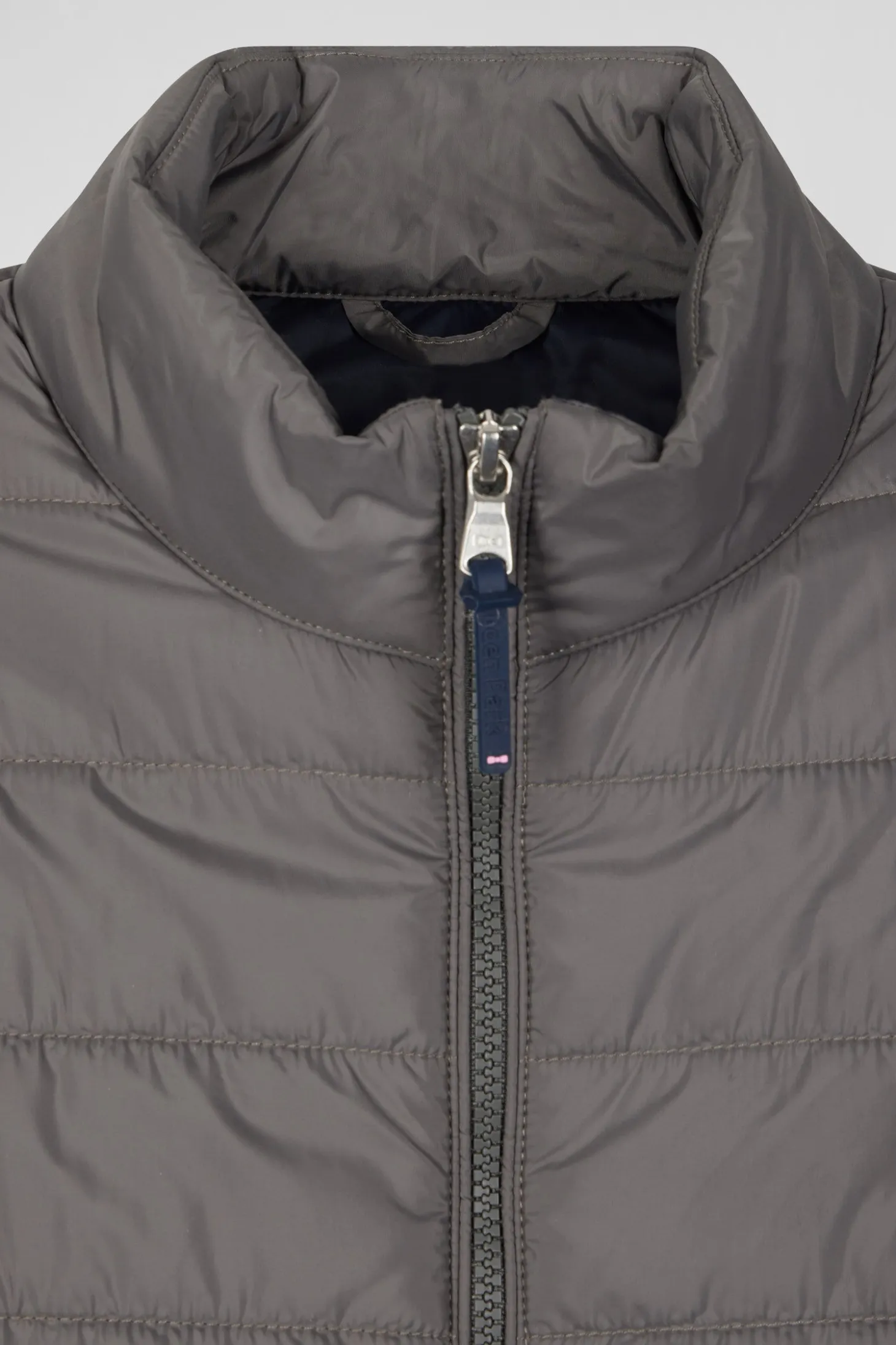Grey quilted sleeveless high collar down vest