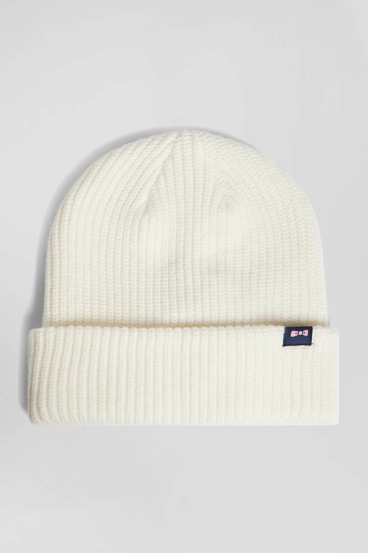 Ivory knitted beanie with bow tie embroidery