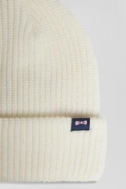 Ivory knitted beanie with bow tie embroidery