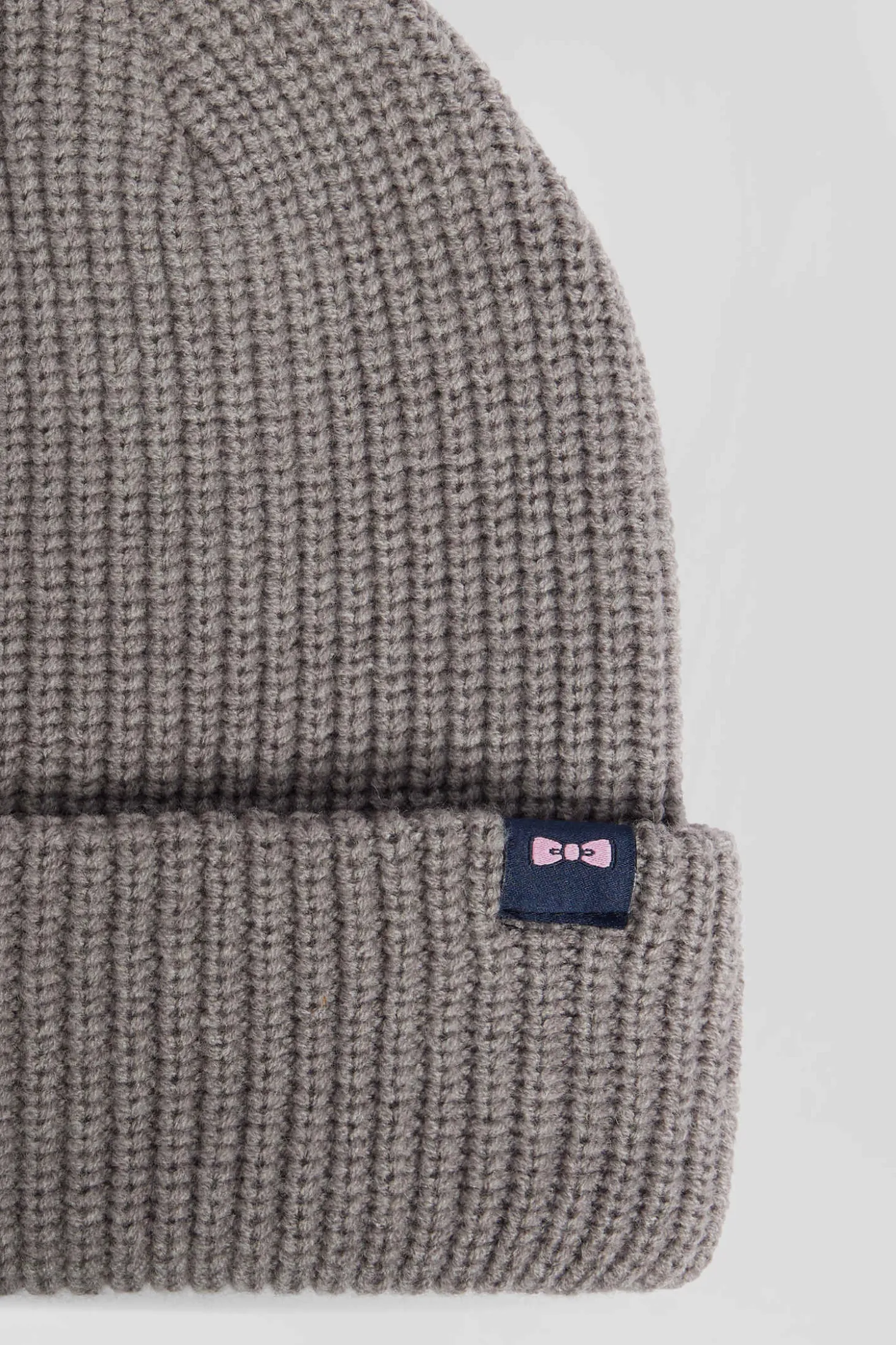Mottled grey knitted beanie with bow tie embroidery