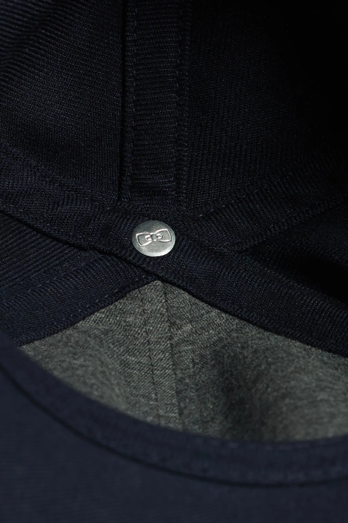 Navy blue cap with rubber badge and tricolour trim