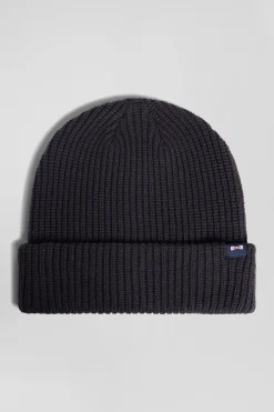 Navy blue knitted beanie with bow tie embroidery