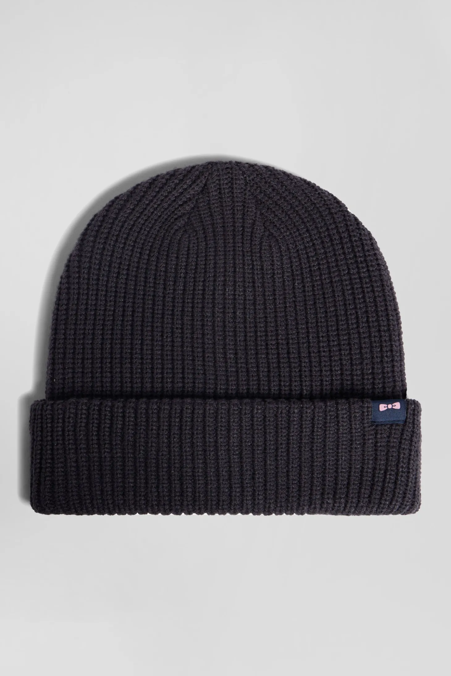 Navy blue knitted beanie with bow tie embroidery