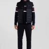Navy blue sleeveless double quilted high collar down vest