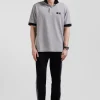 Oversize black short-sleeved cotton piqué polo shirt with tricolor details