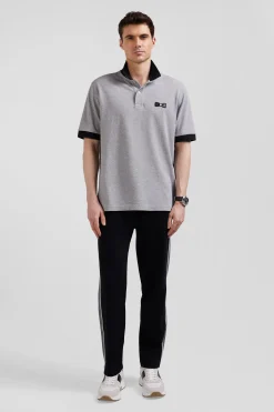 Oversize black short-sleeved cotton piqué polo shirt with tricolor details