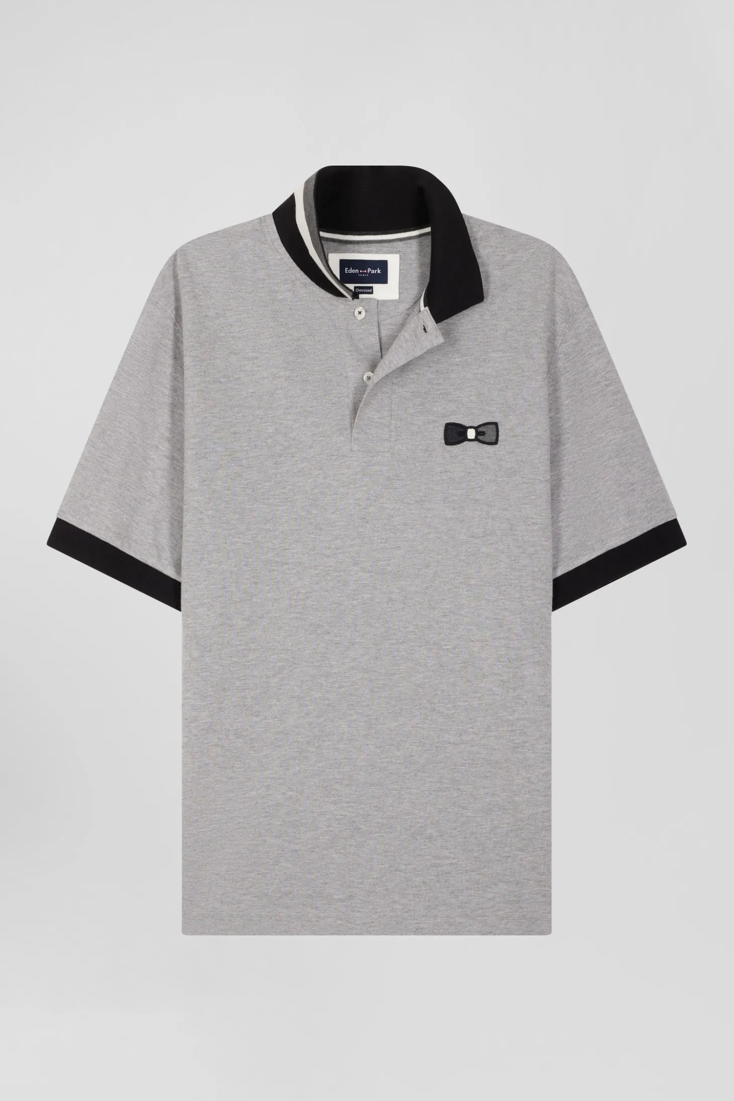 Oversize black short-sleeved cotton piqué polo shirt with tricolor details