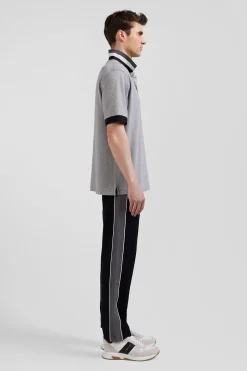 Oversize black short-sleeved cotton piqué polo shirt with tricolor details