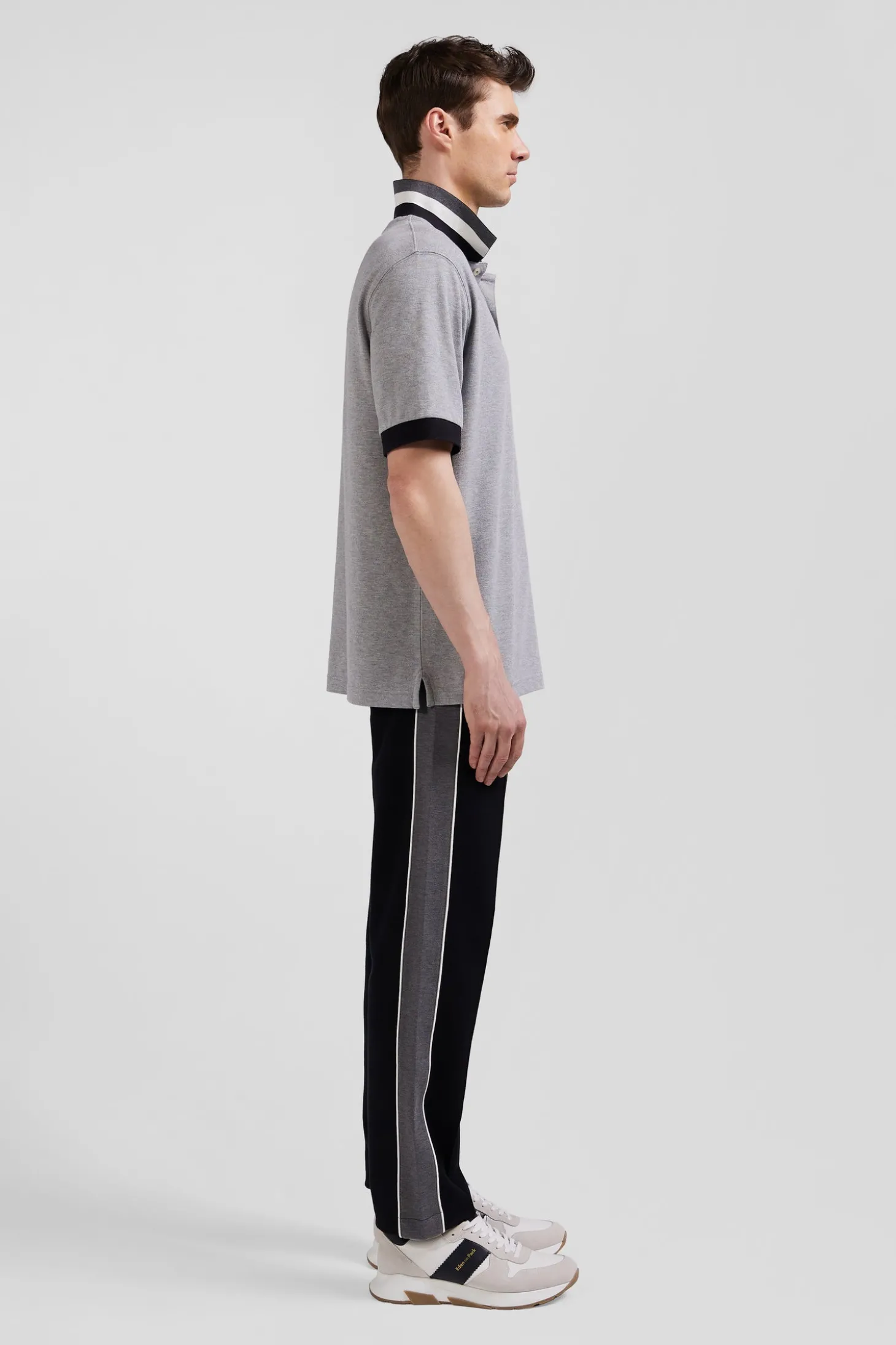 Oversize black short-sleeved cotton piqué polo shirt with tricolor details