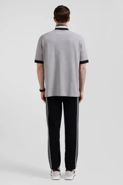 Oversize black short-sleeved cotton piqué polo shirt with tricolor details