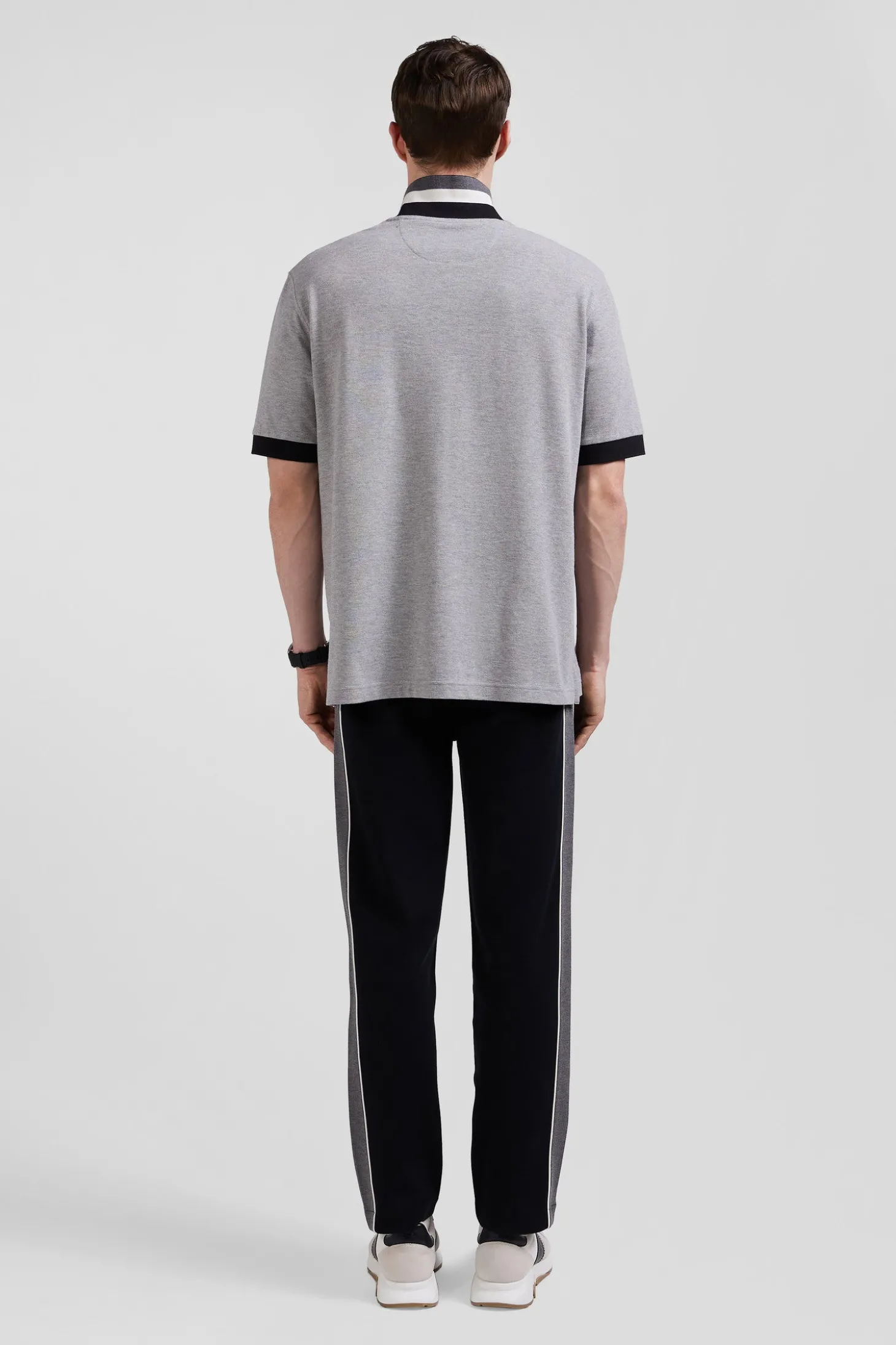 Oversize black short-sleeved cotton piqué polo shirt with tricolor details