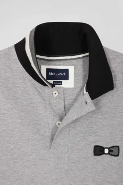 Oversize black short-sleeved cotton piqué polo shirt with tricolor details