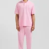 Oversized pink unisex short-sleeved cotton piqué polo shirt