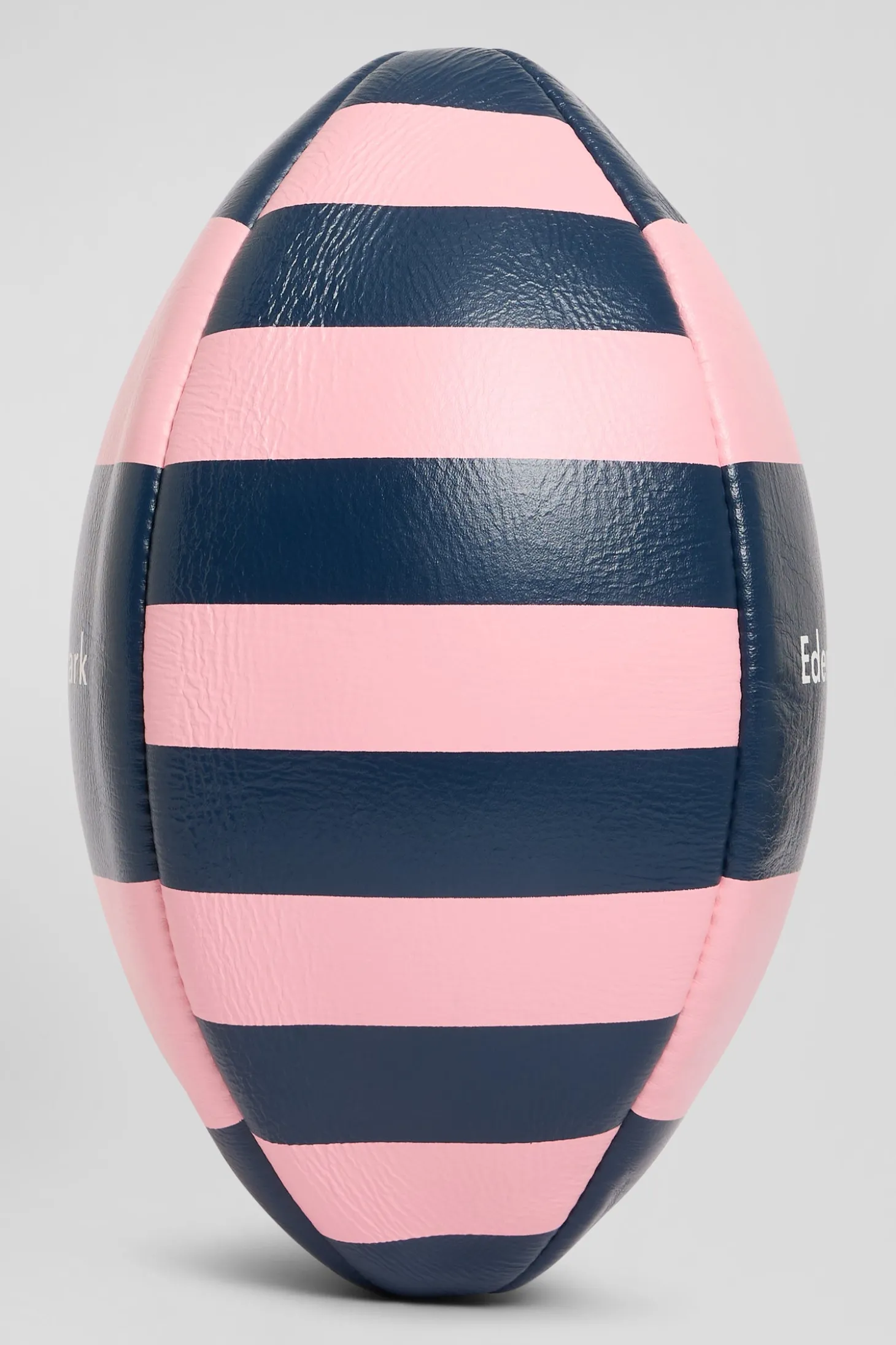 Pink leather rugby ball with striped quarters