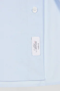 Regular plain sky blue cotton shirt with button-down collar and chest pocket