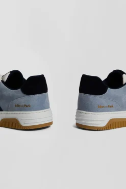 Sky blue low-top leather sneakers with navy blue cut-out
