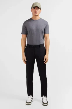 Slim black wool trousers with broken fold
