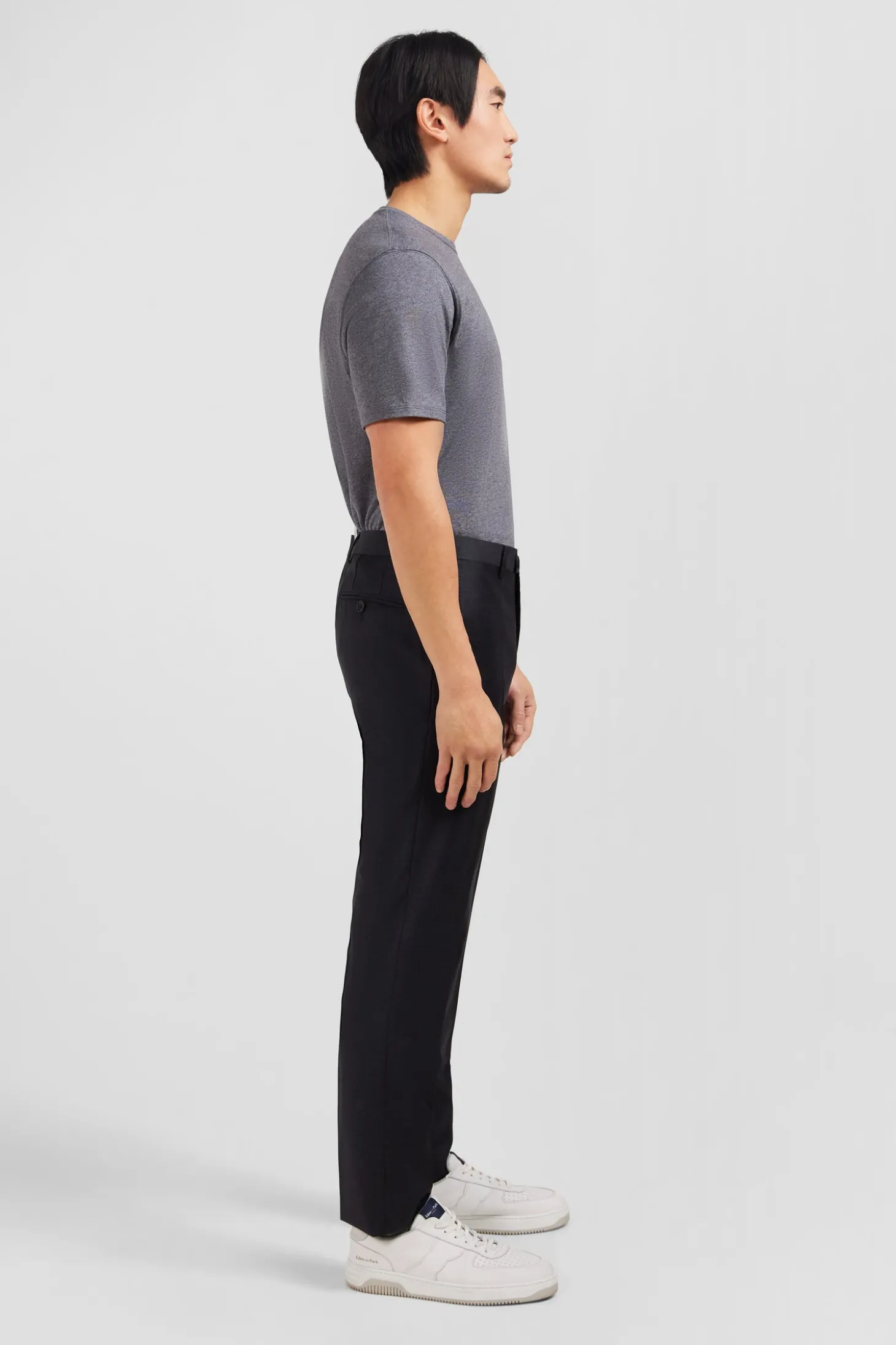 Slim dark grey wool trousers with broken fold